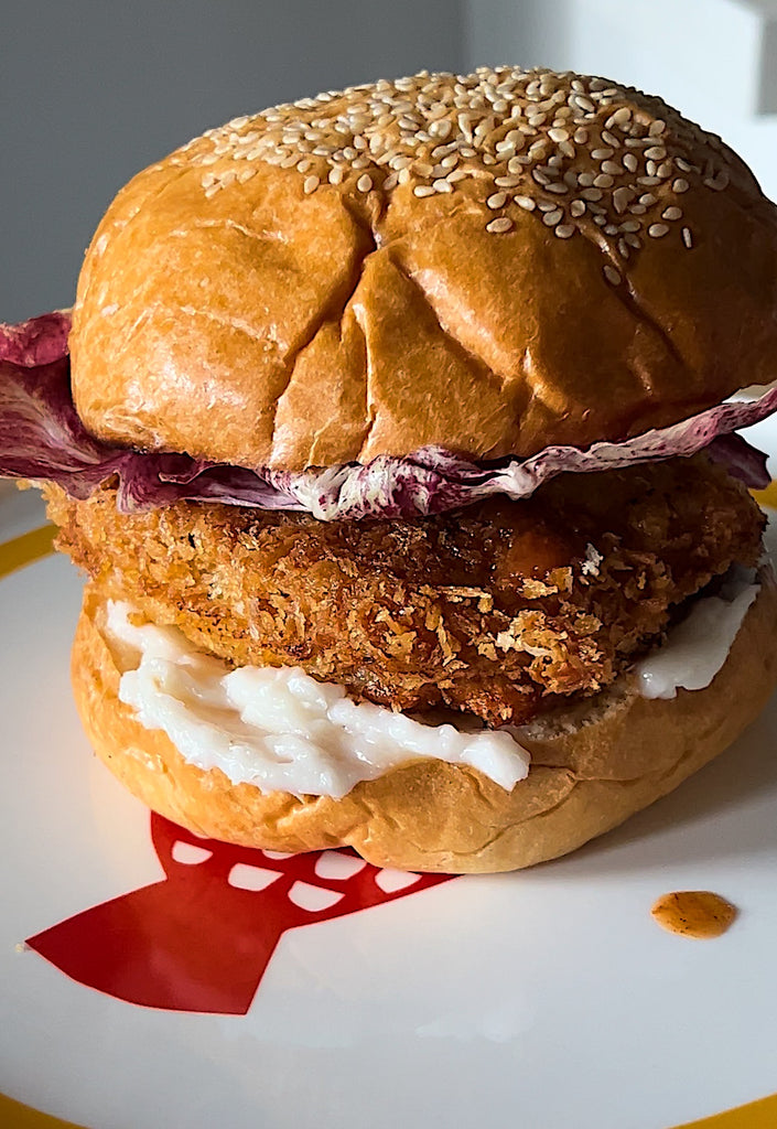 Crumbed pork schnitzel burger