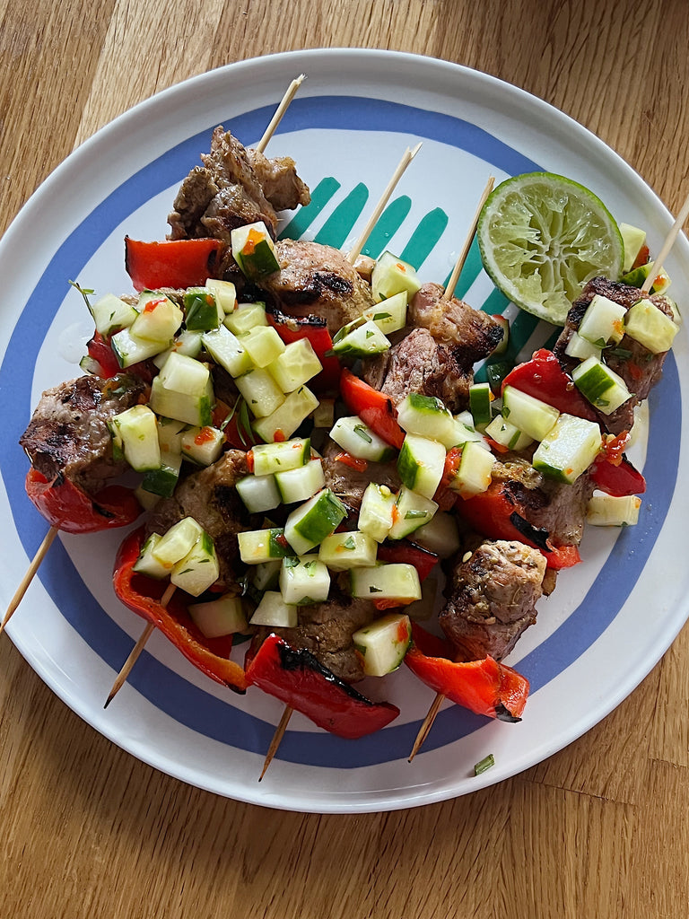Pork and pepper skewers with cucumber salad