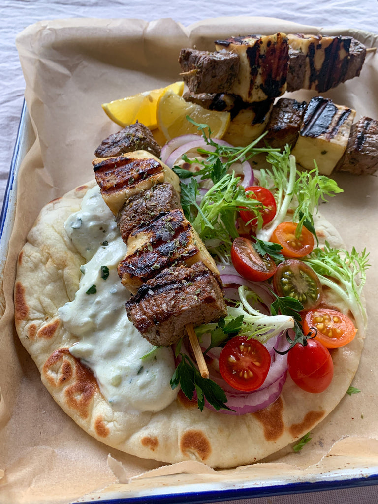 Beef and halloumi skewers with pita bread and tzatziki