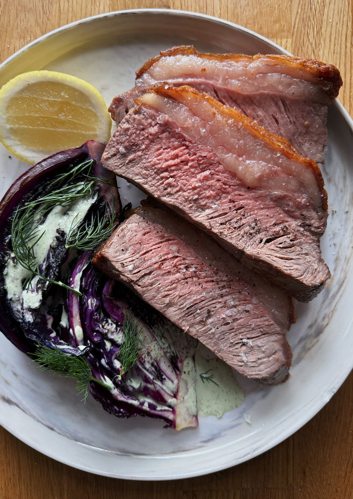 Porterhouse steak with charred cabbage and green goddess dressing